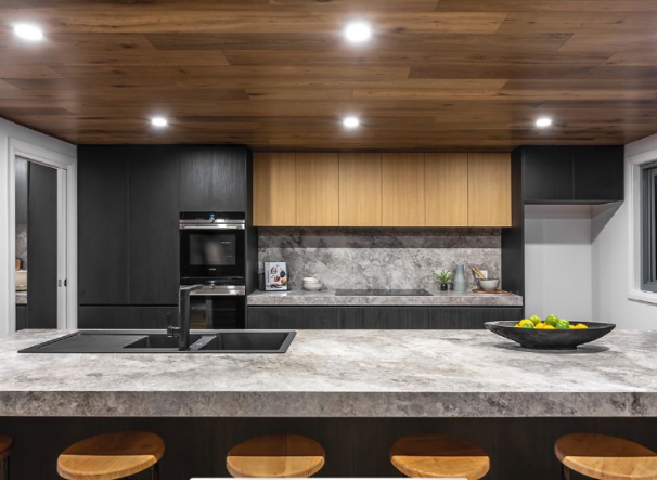 Luxury kitchen with timber ceiling and stone island by Blake Ballard Building