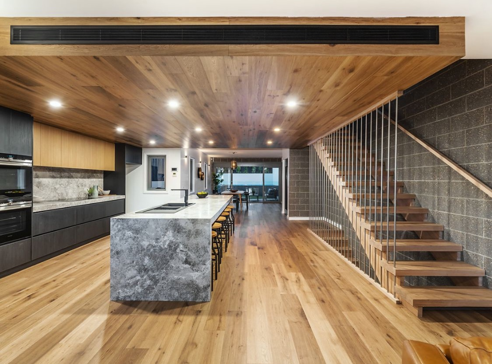 Open-plan kitchen and living fit-out with timber ceiling on the Central Coast